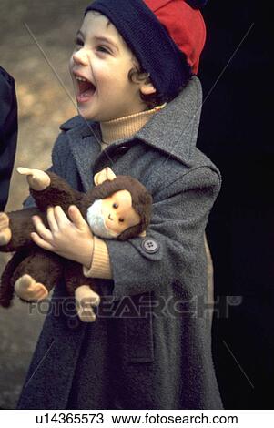 Stock Image - puppet, girl, laughing, happy, monkey, young. Fotosearch