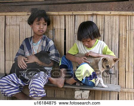Stock Photography - puppies, person, thailand, 9583, children, people. Fotosearch