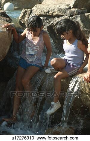 rocks, water, sitting, friends, playing, girl View Large Photo Image Stock Image - rocks, water, sitting, friends, playing, girl. Fotosearch