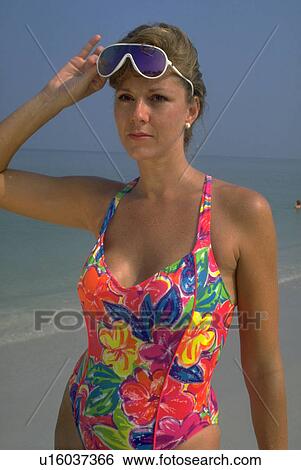 Stock Photograph - saint, swimsuit, beach, blonde, sunglasses, beautiful. Fotosearch