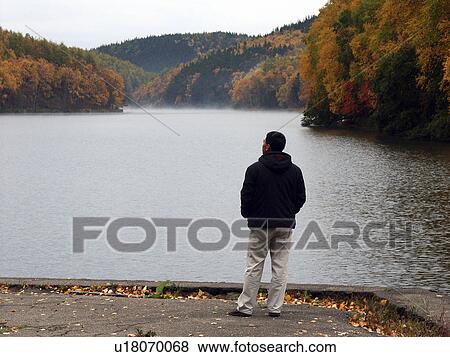 Stock Photo - sakhalin, person, tunaycha, lake, russia, people. Fotosearch