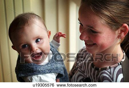 Stock Photograph - smile, girl, happiness, joy, sisters, baby. Fotosearch