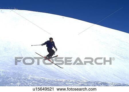 Stock Image - sun, skiing, jumps, male, winter. Fotosearch