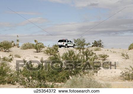 Stock Image - vehicle, border, patrol, usa, person, people. Fotosearch