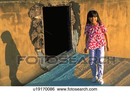 wall, girl, opening, smiling, children, people View Large Photo Image Stock Photograph - wall, girl, opening, smiling, children, people. Fotosearch