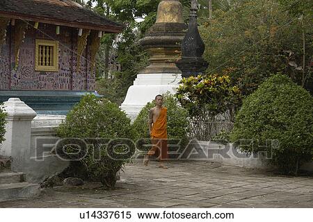 Stock Photography - wat, person, monk, buddhist, laos, people. Fotosearch