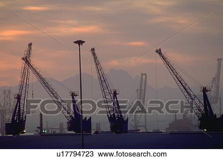 Stock Image - water, building, cranes, construction, business. Fotosearch