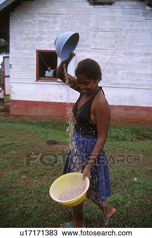 Stock Image - winnowing, girl, nicaragua, 4344, person, people. Fotosearch