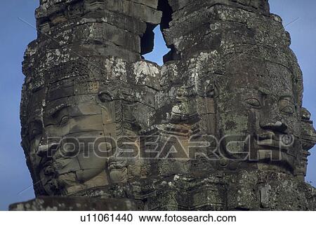 Stock Image - angkor, buddhas, cop, motorcycle, row, carved. Fotosearch