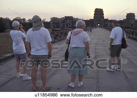 Stock Photograph - angkor, person, visiting, tourists, cambodia, people. Fotosearch