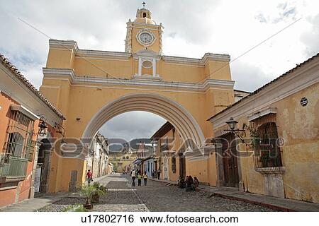 Stock Photograph - arch, person, scene, street, guatemala, people. Fotosearch