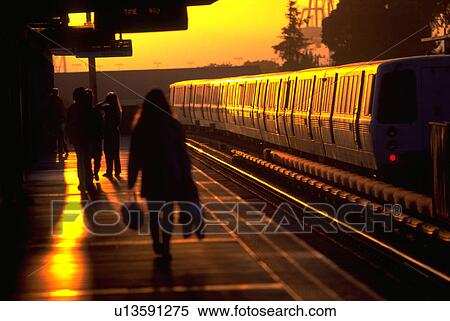 Stock Photography - awaiting, station, passengers, arriving, sunset, bart. Fotosearch