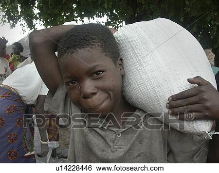 Stock Photograph - bag, people, carrying, boy, person, food. Fotosearch