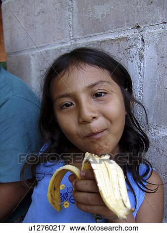 banana, girl, eating, salvador, person, people View Large Photo Image Stock Photo - banana, girl, eating, salvador, person, people. Fotosearch