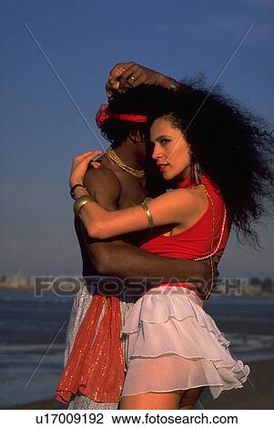Stock Image - beach, couple, love, water, woman. Fotosearch