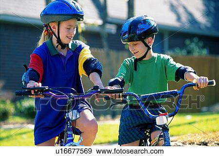 Stock Photo - bicycle, sister, riding, kids, children, brother. Fotosearch