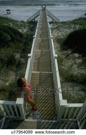 Stock Photo - bikini, woman, pink, bright, female, young. Fotosearch