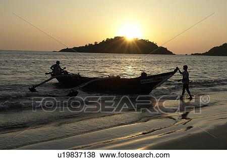Stock Photo - boat, people, fishing, india, person, beach. Fotosearch