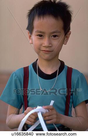 Stock Image - boy, people, vietnamese, home, children, family. Fotosearch