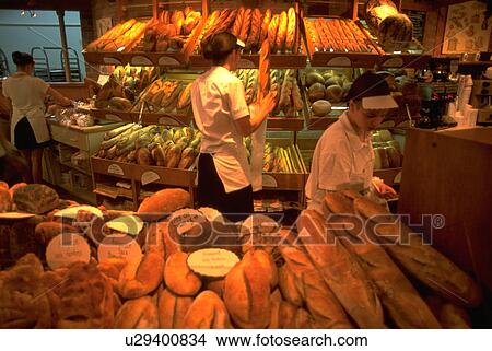 Picture - bread, interior, canada, montreal, bakery, woman. Fotosearch