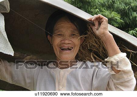 Stock Image - carrying, people, female, vietnam, person, woman. Fotosearch