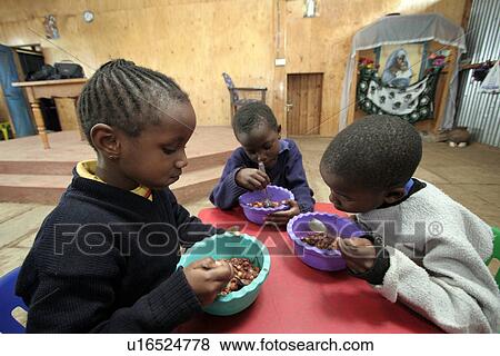 Stock Photo - children, food, person, child, people, background. Fotosearch