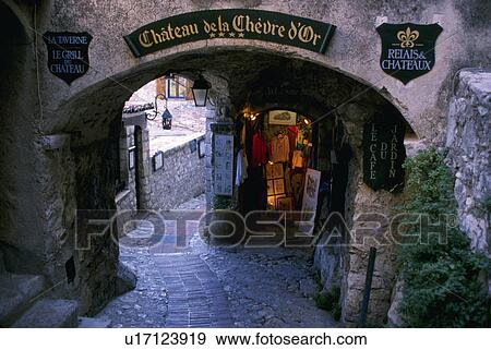 Stock Photo - cobblestone, arch, leads, street, narrow. Fotosearch