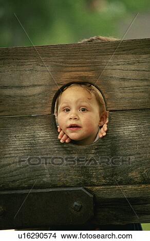 colony, boy, stocks, through, peers, little View Large Photo Image Picture - colony, boy, stocks, through, peers, little. Fotosearch
