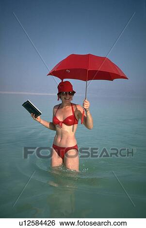 Stock Photograph - dead, bikini, umbrella, suit, bathing, red. Fotosearch