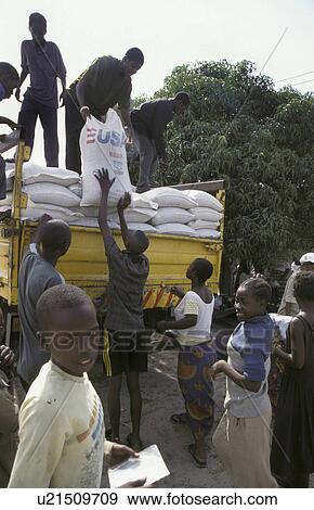 Stock Photo - distribution, people, zambia, person, hand, food. Fotosearch