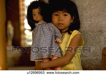 Stock Image - doll, girl, holds, kid, child, house. Fotosearch