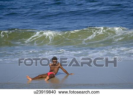 Stock Image - enjoying, water, lying, sun, person, beach. Fotosearch