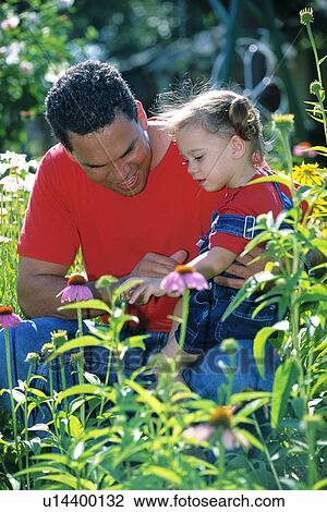 Stock Image - father, kid, flowers, girl, young, child. Fotosearch