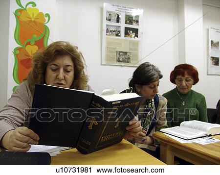 Stock Image - females, people, women, book, person, background. Fotosearch