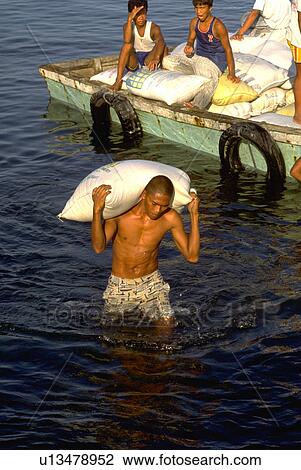 Stock Image - filipino, heavy, carries, male, water. Fotosearch