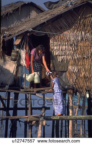 Stock Photo - filipino, water, home, girl, house, family. Fotosearch