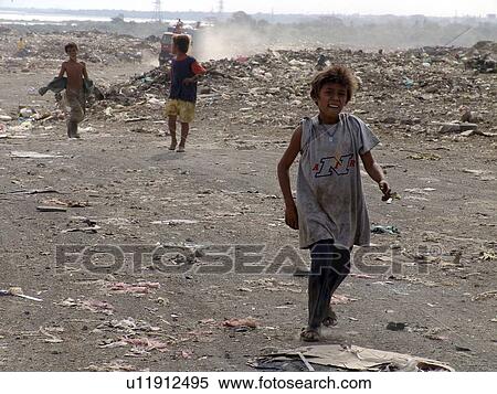 Stock Photography - garbage, person, managua, boys, nicaragua, people. Fotosearch