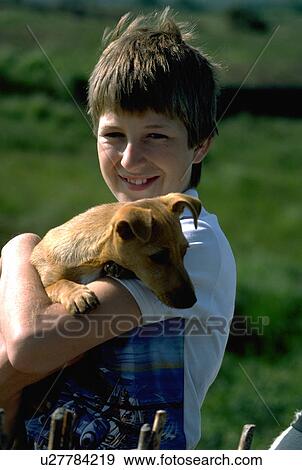 girl, puppy, pet, holds, young View Large Photo Image Stock Photo - girl, puppy, pet, holds, young. Fotosearch