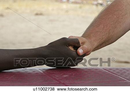 Stock Photo - hand, namibia, person, border, people. Fotosearch