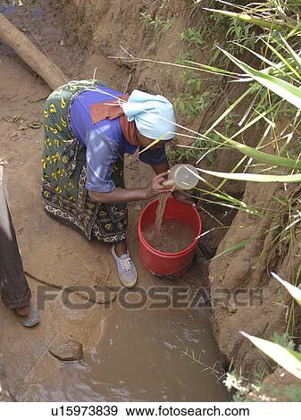 Stock Photo - home, woman, person, people, water, family. Fotosearch