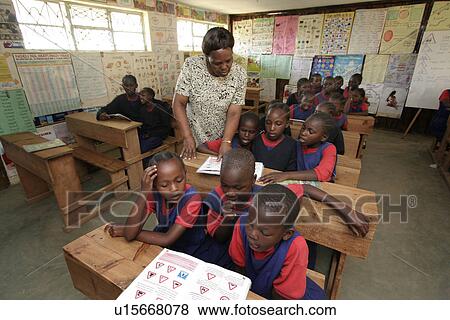 Stock Photo - kenya, people, book, school, person, background. Fotosearch