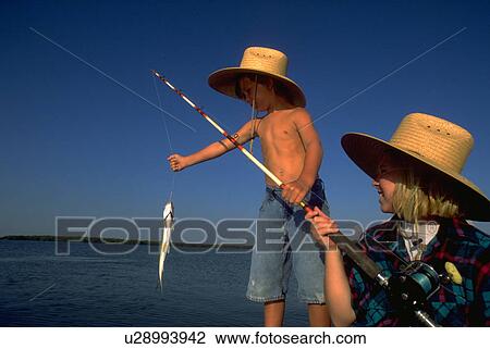 Stock Image - kid, love, sun, fish, child, water. Fotosearch