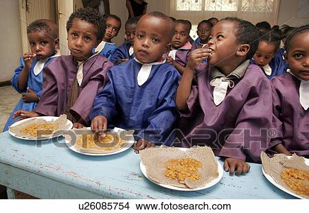 Picture - kid, people, children, person, child, food. Fotosearch