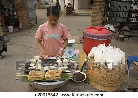 Stock Image - making, people, laos, person, girl, food. Fotosearch