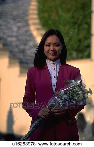 Stock Photo - manila, flowers, holding, uniform, female, woman. Fotosearch