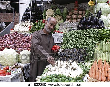 Stock Image - market, person, outdoor, vegetable, egypt, people. Fotosearch