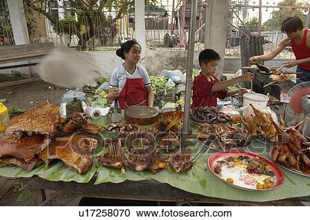 Stock Image - meat, people, cooked, laos, person, food. Fotosearch