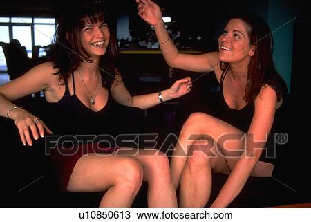 Stock Image - montreal, two, gesturing, girls, smiling, women. Fotosearch