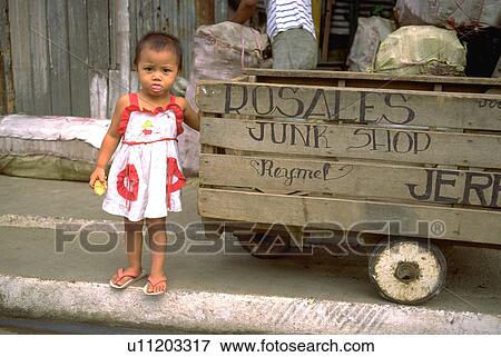 Stock Photo - next, girl, stands, kid, child, baby. Fotosearch