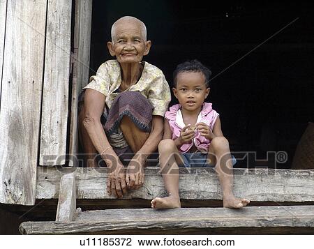 Stock Image - old, child, cambodia, home, person, people. Fotosearch